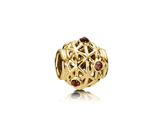 Gold charm, rhodolite